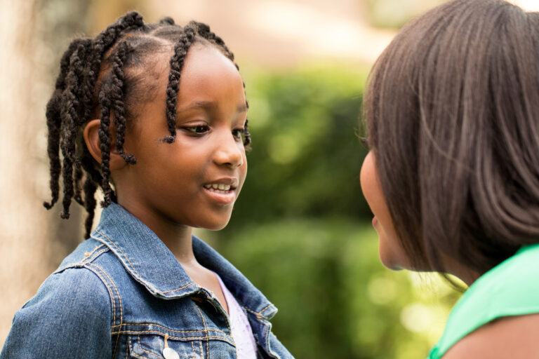 A girl talking to her mother