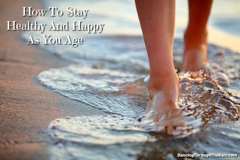 A woman's feet walking in the water on the beach
