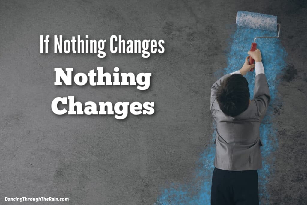 A child standing on gray stone pavement holding a rolling pin and painting a gray wall light blue with the words If Nothing Changes Nothing Changes